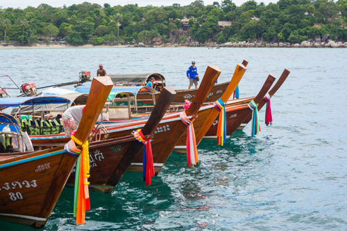 Wooden colourful river boats on Thailand yacht charter
