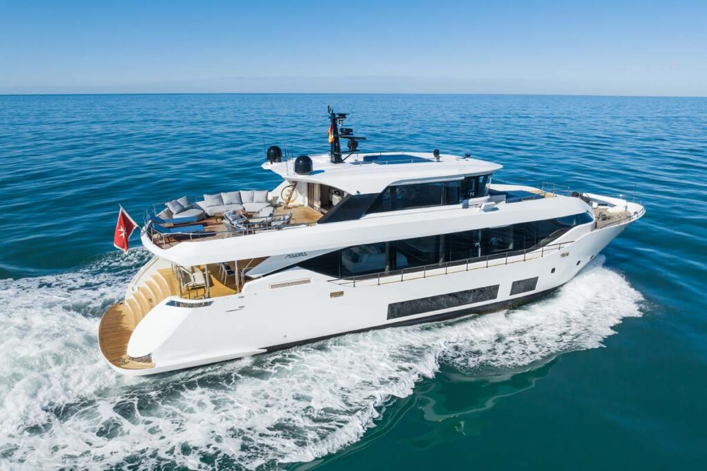 Running profile of ZOUT, a 100' Maiora yacht for sale that will be at the 2024 Monaco Yacht Show.