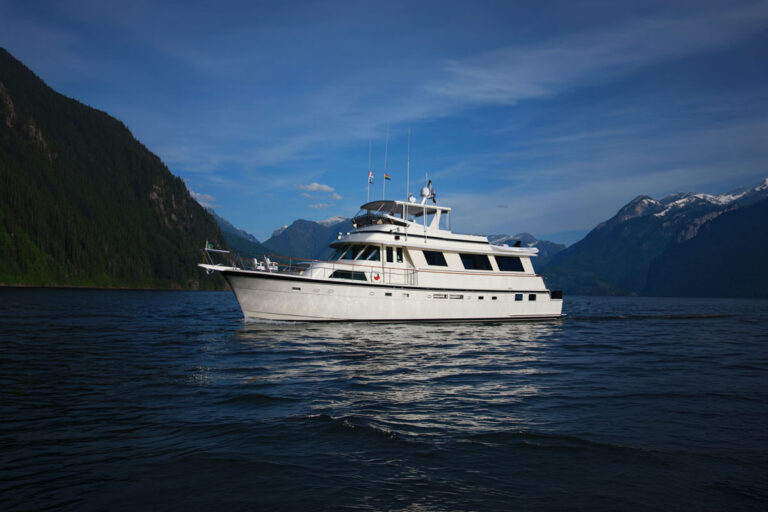 Profile of NORTHERN LIGHT, a 74 foot Hatteras yacht for charter in the Pacific Northwest.