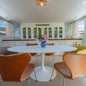 Main dining of SOVEREIGN, a 100' Burger yacht for charter in the Dominican Republic.