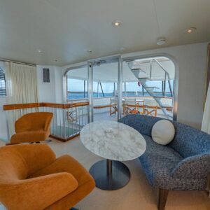 Main salon of SOVEREIGN, a 100' Burger yacht for charter in the Dominican Republic.