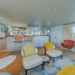 Main salon of SOVEREIGN, a 100' Burger yacht for charter in the Dominican Republic.