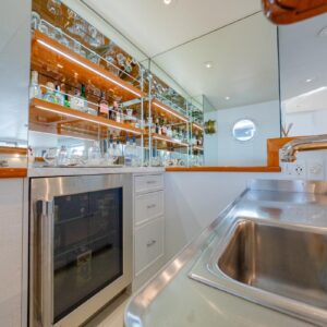 Main salon bar of SOVEREIGN, a 100' Burger yacht for charter in the Dominican Republic.