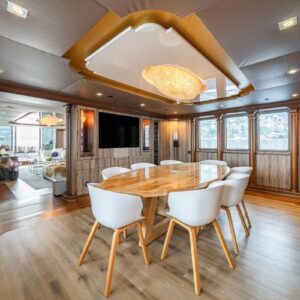 Main dining of IRAMA, a 137 foot Concept Marine yacht for charter in the Mediterranean.