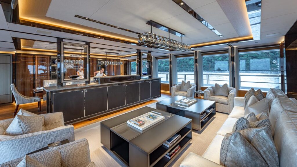 Main salon of TOP FIVE II, a 200-foot Royal Hakvoort yacht for charter in The Bahamas and Caribbean.