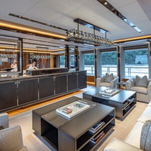 Main salon of TOP FIVE II, a 200-foot Royal Hakvoort yacht for charter in The Bahamas and Caribbean.