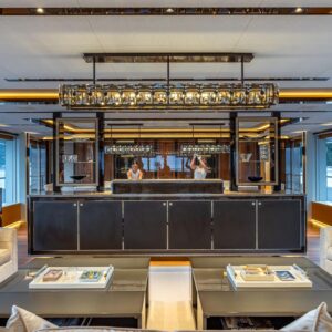 Main salon of TOP FIVE II, a 200-foot Royal Hakvoort yacht for charter in The Bahamas and Caribbean.