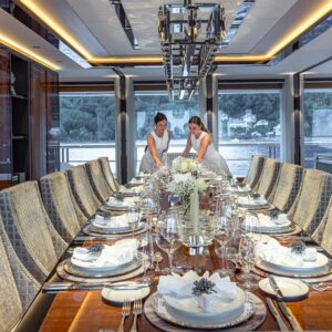 Main dining of TOP FIVE II, a 200-foot Royal Hakvoort yacht for charter in The Bahamas and Caribbean.