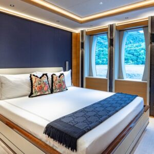 Guest stateroom of TOP FIVE II, a 200-foot Royal Hakvoort yacht for charter in The Bahamas and Caribbean.