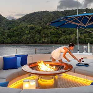 Firepit aboard TOP FIVE II, a 200-foot Royal Hakvoort yacht for charter in The Bahamas and Caribbean.