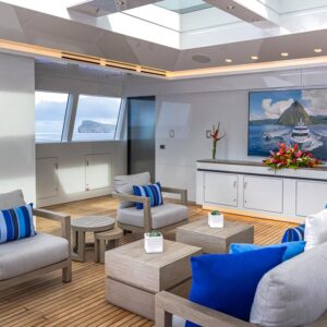 Outdoor lounge aboard TOP FIVE II, a 200-foot Royal Hakvoort yacht for charter in The Bahamas and Caribbean.