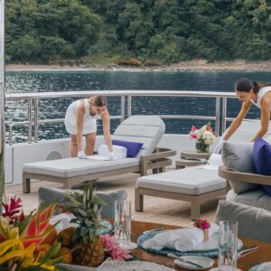 Outdoor lounge aboard TOP FIVE II, a 200-foot Royal Hakvoort yacht for charter in The Bahamas and Caribbean.