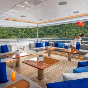 Outdoor lounge aboard TOP FIVE II, a 200-foot Royal Hakvoort yacht for charter in The Bahamas and Caribbean.