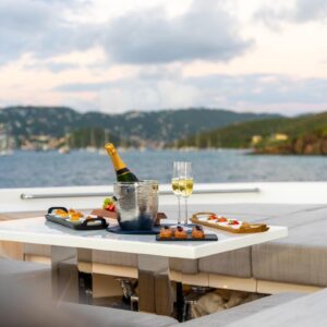 Champagne aboard SWEET VIRGINIA, a 96′ Sanlorenzo yacht for charter in The Bahamas.