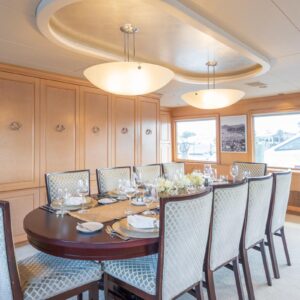 Main dining of CHANSON, a 120 foot Christensen yacht for charter in The Bahamas.