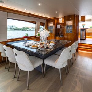 Main dining of INDY, an 85 foot Hatteras yacht for charter in New England.