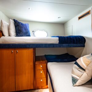 Guest stateroom of INDY, an 85 foot Hatteras yacht for charter in New England.