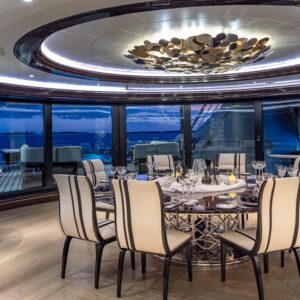 Main dining of OKTO, a 218 foot ISA yacht for charter in the Mediterranean.
