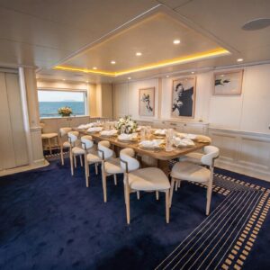Main dining of JUBILEE, a 151 foot Pendennis yacht for charter in the Mediterranean.