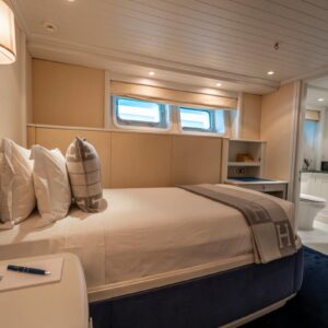 Guest stateroom of JUBILEE, a 151 foot Pendennis yacht for charter in the Mediterranean.