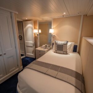 Guest stateroom of JUBILEE, a 151 foot Pendennis yacht for charter in the Mediterranean.
