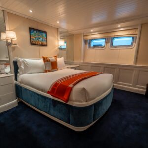 Guest stateroom of JUBILEE, a 151 foot Pendennis yacht for charter in the Mediterranean.