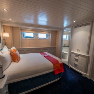 Guest stateroom of JUBILEE, a 151 foot Pendennis yacht for charter in the Mediterranean.