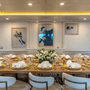 Main dining of JUBILEE, a 151 foot Pendennis yacht for charter in the Mediterranean.