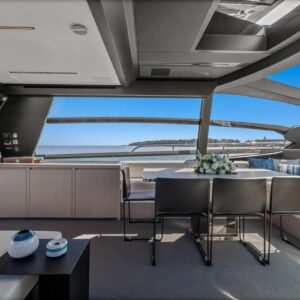 Main dining of SAMIRA, a 76-foot Riva yacht for charter in the Mediterranean.