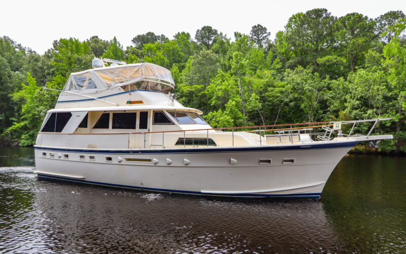 Profile of STARFIRE , a 56′ Hatteras GT yacht for sale with twin CAT engines, three staterooms and a hardtop flybridge.