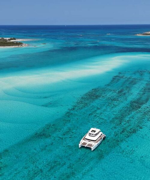 Running profile of PLAYTIME, a 64 foot Lagoon yacht for charter in The Bahamas.