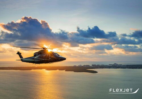 Flexjet Sikorsky S-76 Helicopter flying over the Intracoastal Waterway