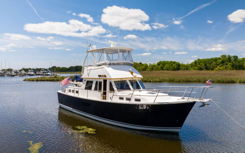 Profile of NELLIE, a 47′ Sabreline trawler yacht for sale with 2 staterooms, a U-shaped galley and a flybridge with a hardtop.