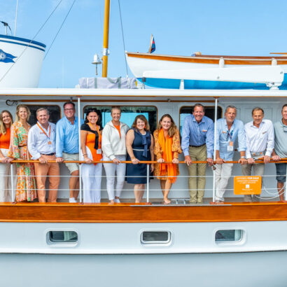 New England Yacht Experts taking a team photo at the Newport Boat Show.