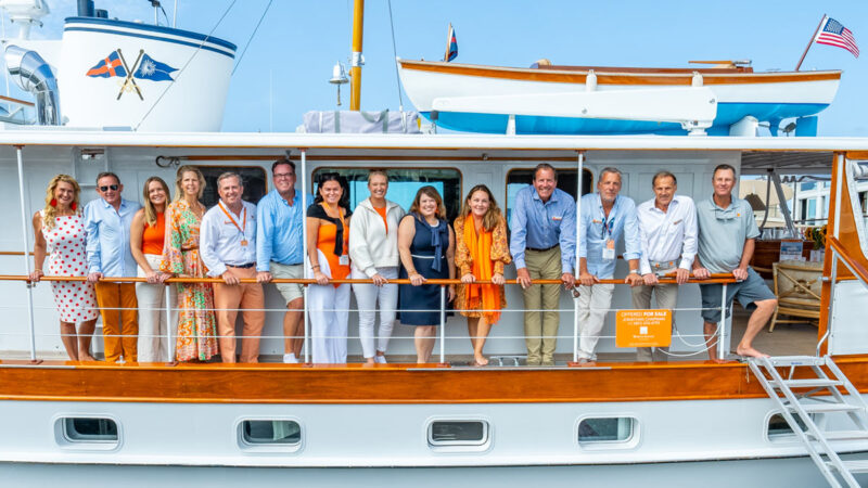 New England Yacht Experts taking a team photo at the Newport Boat Show.