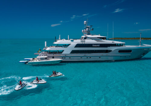 Superyacht STARSHIP 185' Delta Marine at anchor with yacht toys and jet skis