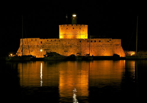 Saint Nicolas Fort Rhodes Harbour at night, medieval Greece yacht charter