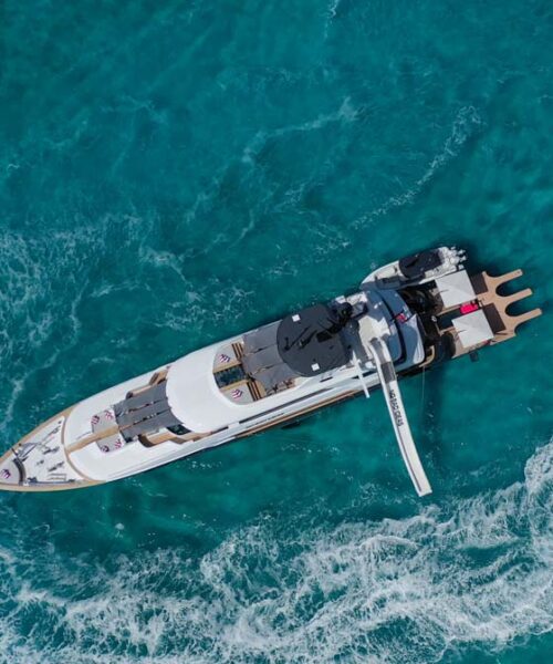 Aerial profile of NO BAD IDEAS, a 160' Trinity yacht for sale.