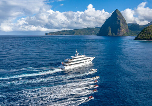 Running profile of TOP FIVE II, a 200-foot Royal Hakvoort yacht for charter in The Bahamas. The perfect yacht for a winter yacht charter.