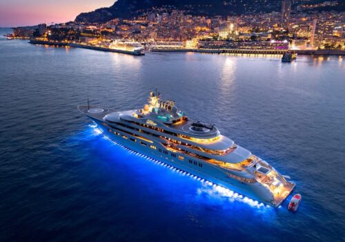 Yacht DILBAR aerial shot at night with city skyline